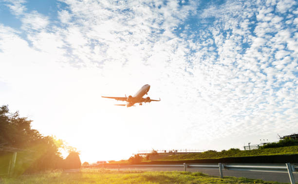 istock Airplane flying over the green grass 1148579987