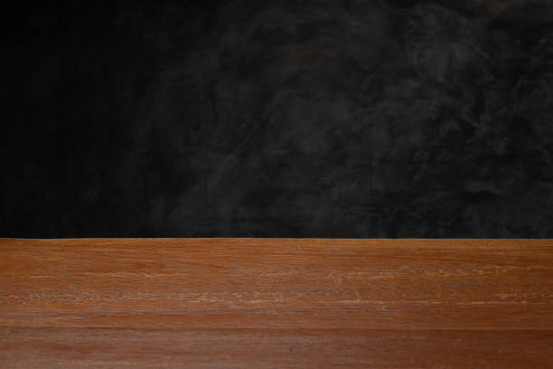 istock Dark gray loft concrete wall background, Texture with wooden table top 1148581072