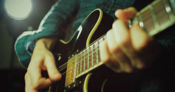 istock Vintage rock guitarist playing guitar 1148582460