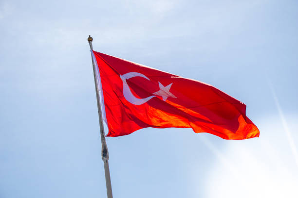 istock Turkish national flag with white star and moon in sky 1148584485
