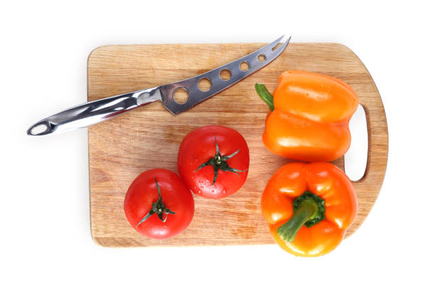 istock tomato orange pepper on the board isolated background 1148584864