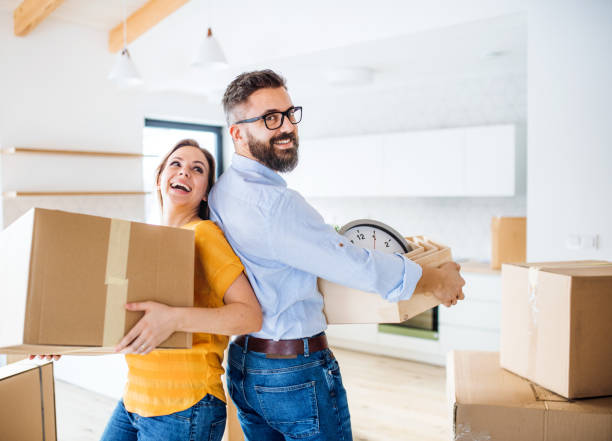 istock A young couple moving in new home, having fun. 1148585957