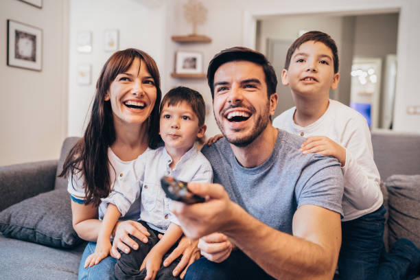 istock Family watching television 1148585973
