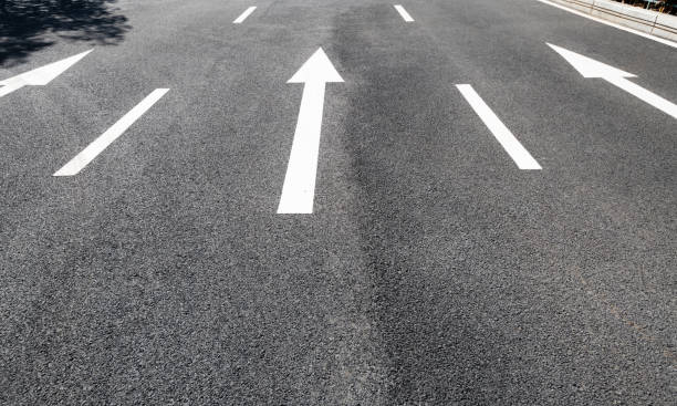 istock Arrow signs on asphalt road 1148586396