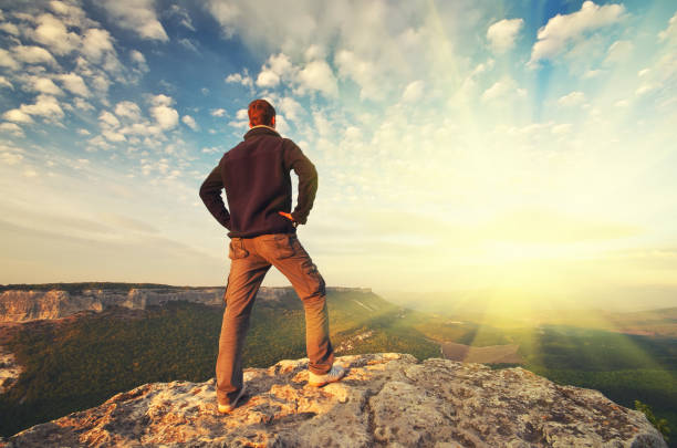 istock Man on top of mountain. 1148589719