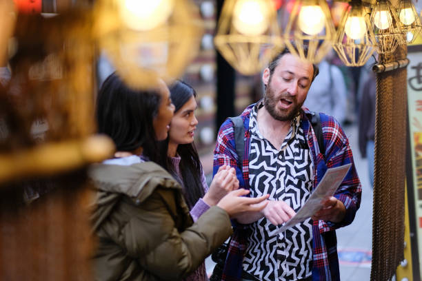 istock Tourists looking at menu in front of restaurant 1148589930