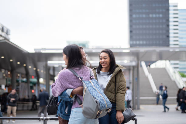 istock Women embracing on street 1148590323