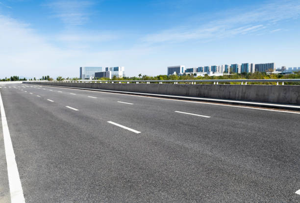 istock Empty asphalt road with buildings in the city 1148590418