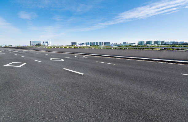 istock Empty asphalt road with buildings in the city 1148591065
