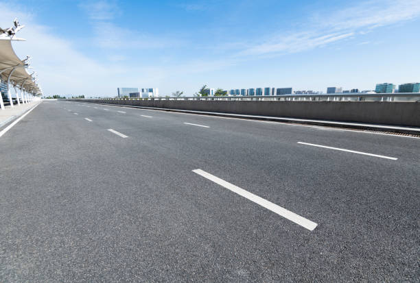 istock Empty asphalt road with buildings in the city 1148591137