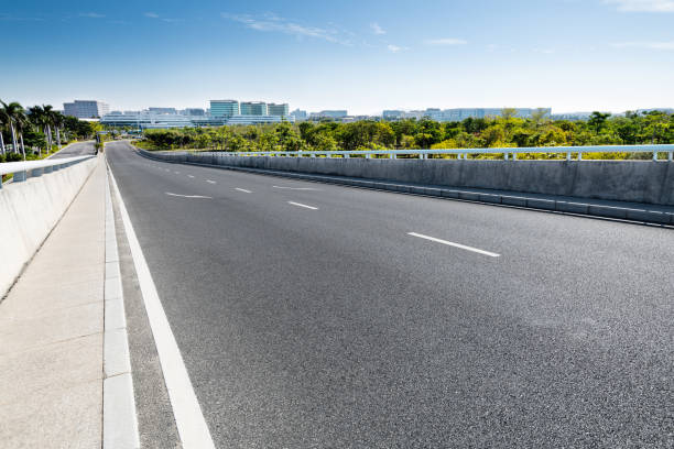 istock Empty asphalt road with buildings in the city 1148591305