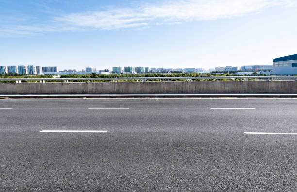istock Empty asphalt road with buildings in the city 1148591369