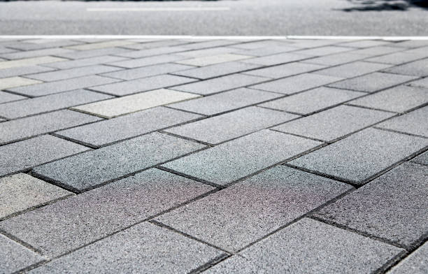 istock Brick sidewalk and asphalt street 1148591740