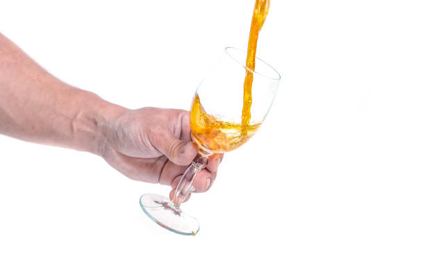The process of pouring beer with foam in a glass glass