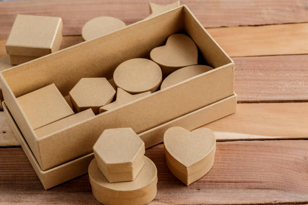 istock cardboard biodegradable eco-friendly gift boxes on wooden background 1148592804