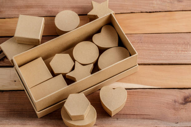 istock cardboard biodegradable eco-friendly gift boxes on wooden background 1148592811