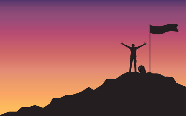 istock Silhouette happy man raising hand standing on top of mountain 1148593901