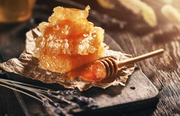 istock Honey Dipper and honyecomb 1148593951