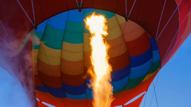 fire from gas jet burner in hot air balloon - inflating balloon blowing air imagens e fotografias de stock