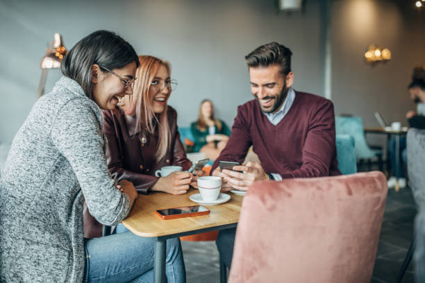 istock Group of friends sitting in cafe 1148597994