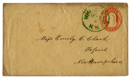 Whitefield, New Hampshire, The USA  - 9 May 1856: US historical envelope: cover with red embossed imprinted stamp, three cents George Washington profile, green postal cancellation