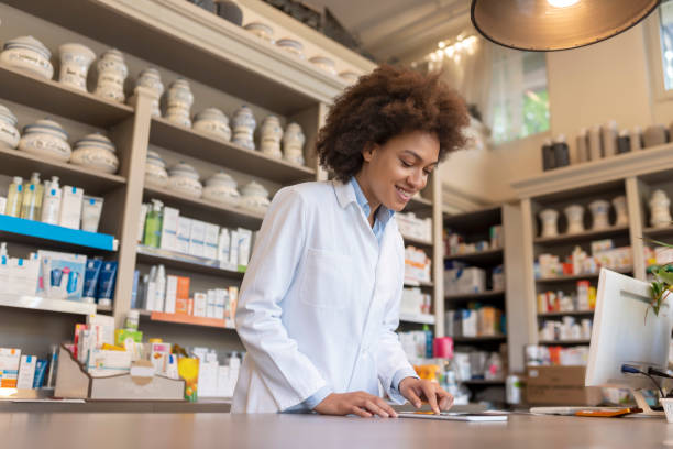 istock Pharmacist with digital tablet in a chemist store 1148600996