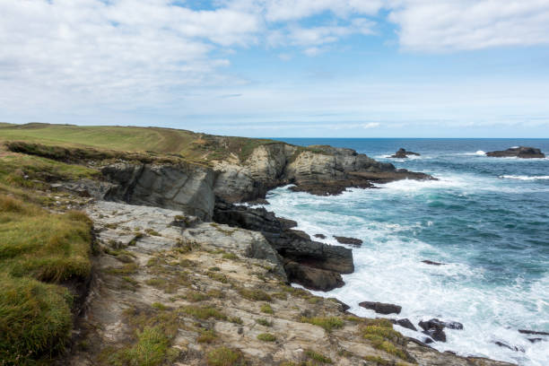 istock Wonderful foamy ocean waves  and beautiful rocky cliffs 1148605659