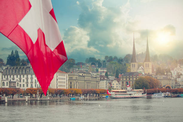 istock Red flag in Lucerne, Switzerland during twilight hour. View on lake 1148608503
