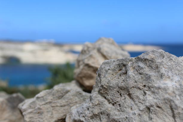 istock Rock in the Focus with a beach view 1148609811