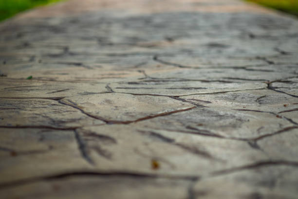 Close up view of walkway concrete stamped material, selective focus. Close up view of walkway concrete stamped material, selective focus. pedestrian walkway stock pictures, royalty-free photos & images