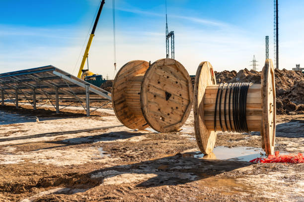 istock Wooden coils with a high-voltage cable for joining sections of solar panels 1148611049