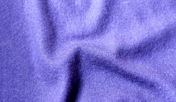 istock Background texture of purple pattern knitted fabric made of cotton or wool. 1148611075