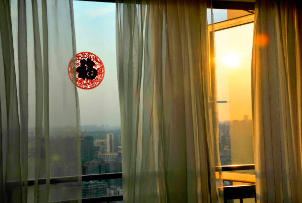 Curtain and paper-cut in sunrise background