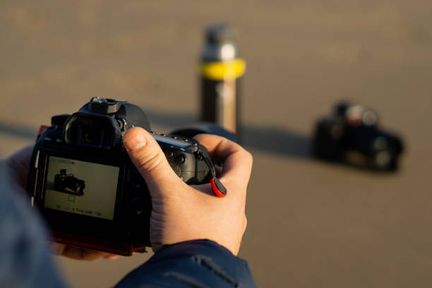 istock Man taking a photograph with DSLR camera 1148614357