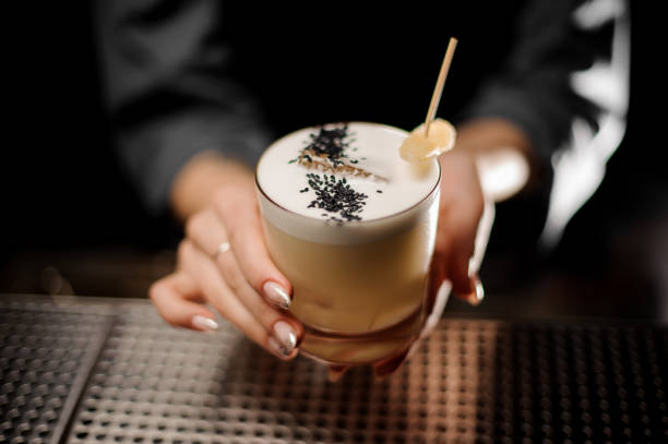 istock Close-up of alcohol cocktail in bartender's hands 1148617637