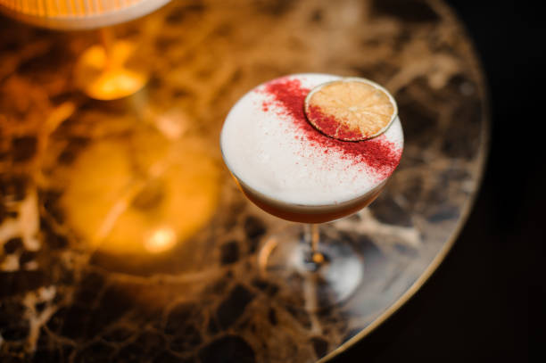 istock Close-up of alcohol cocktail on table with lamp 1148617735
