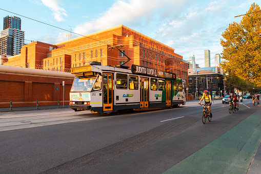 Melbourne, Australia - April 16, 2019: Tram and cyclist at La Trobe St at Melbourne CBD.
