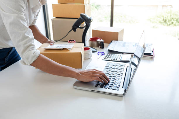 istock Small business owner delivery service and working packing box, business owner working checking order to confirm before sending customer in post office, Shipment Online Sales 1148620523