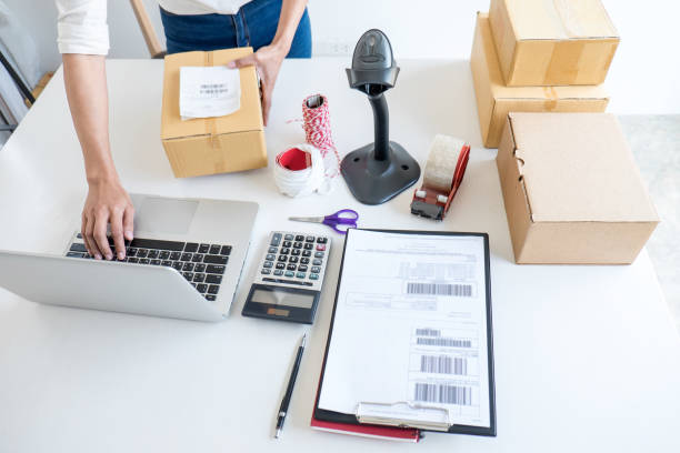 istock Small business owner delivery service and working packing box, business owner working checking order to confirm before sending customer in post office, Shipment Online Sales 1148620536