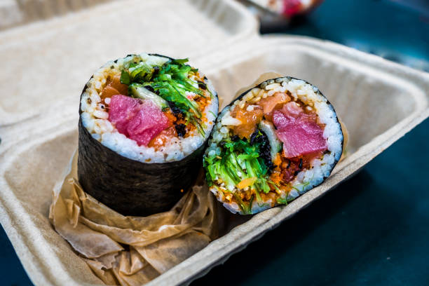 Sushi burrito is a new fusion Japanese food with modern society Sushi burrito is a new fusion Japanese food with modern society, which created an amazing taste and texture. It is being serve as one of the most famous dish in New York city that everybody should eat burrito stock pictures, royalty-free photos & images