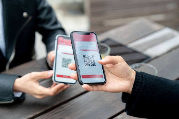 Mobile to mobile payment transfer Mobile to mobile payment transfer. Tokyo, Japan coding qr code mobile phone telephone stock pictures, royalty-free photos & images