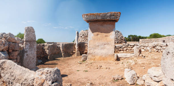 Standing Taula Stone and Taula enclosure, Trepuco, one of many prehistoric mysterious megaliths of the Talaiotic people in Menorca, Spain.