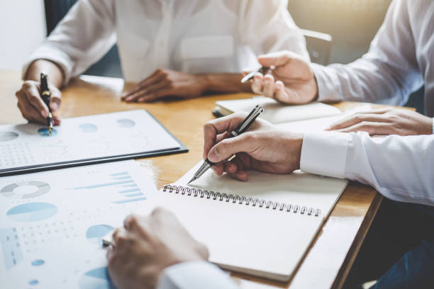 istock Co working conference, Business team meeting present discussing working analysis with financial data and marketing growth report graph in team, Finance, accounting, investment 1148622118