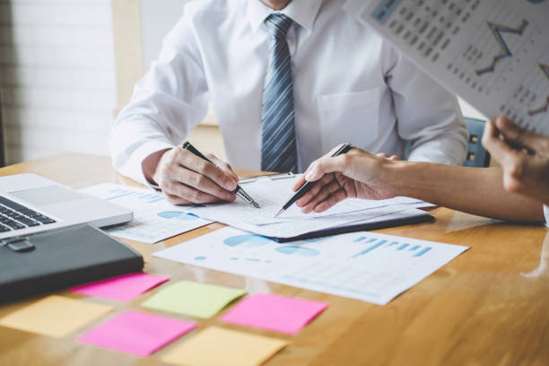 istock Co working conference, Business team meeting present discussing working analysis with financial data and marketing growth report graph in team, Finance, accounting, investment 1148622119