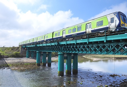 10th May 2019, County Meath, Ireland. Irish Rail train crossing Laytown viaduct bridge over the River Nanny in Laytown, County Meath.