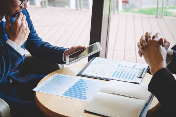 istock Professional executive manager, Business partner discussing ideas marketing plan and presentation project of investment at meeting and analyzing on document data, financial and investment concept 1148622537
