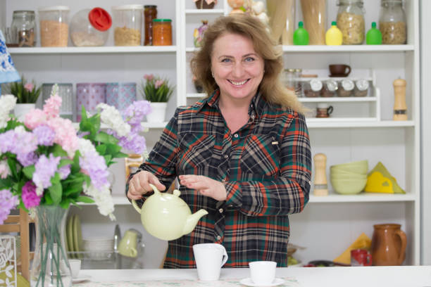 Senior woman drinking herbal tea in the living room