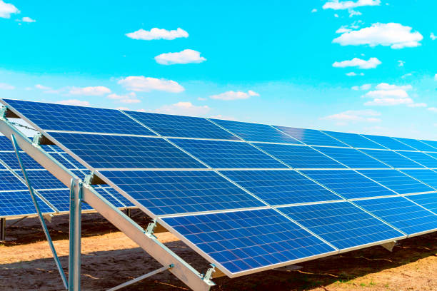 istock Sections of solar panels on the blue sky background 1148623623