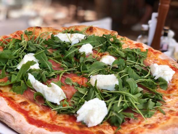 istock Ham pizza with rucola and ricotta 1148623956
