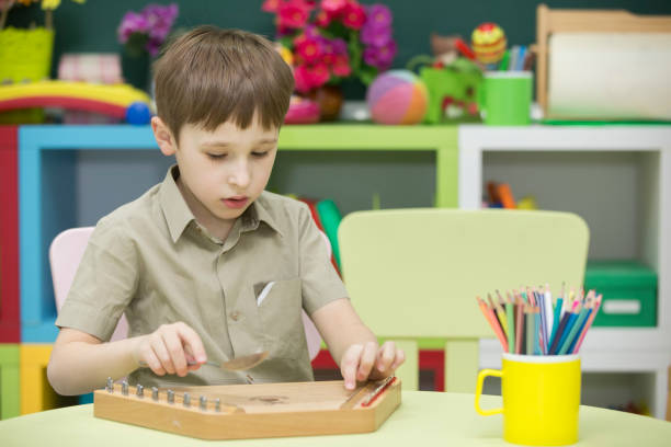 istock A child with a musical instrument. Boy learn to play dulcimer 1148624013